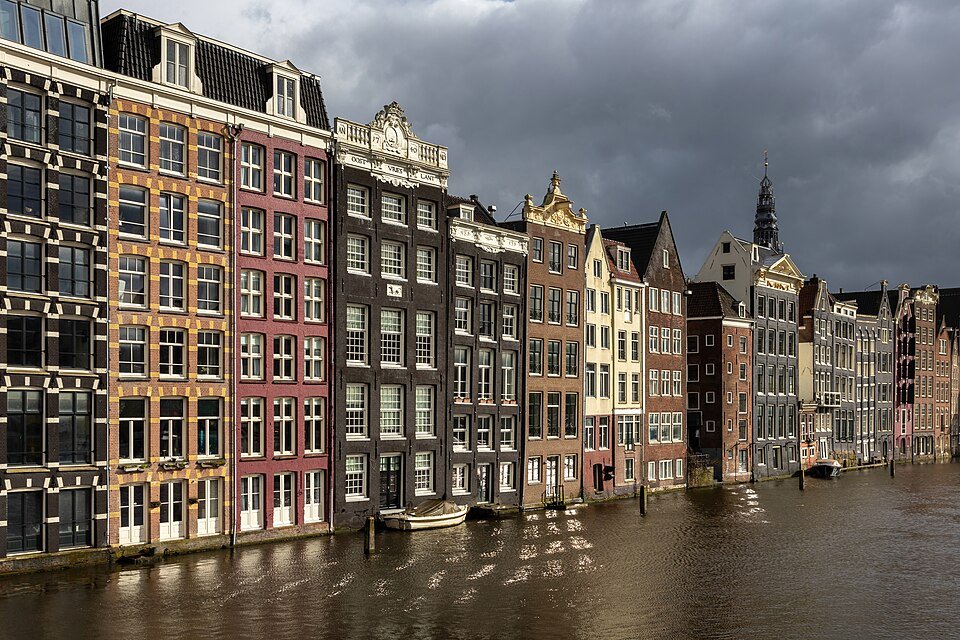 Canal houses along the Damrak in Amsterdam